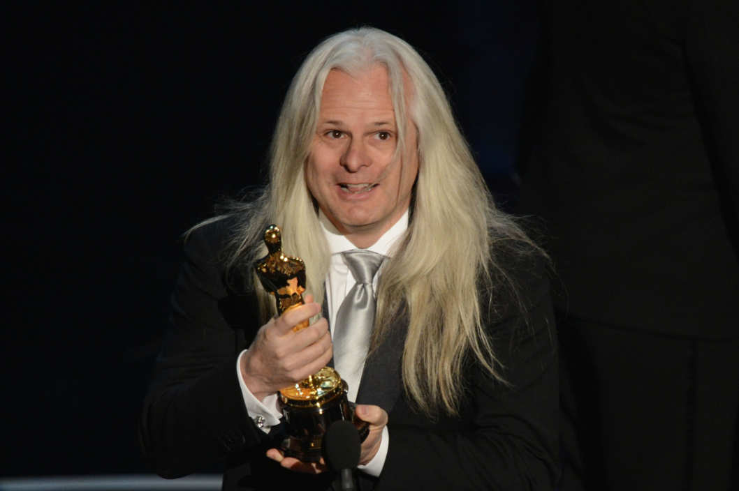 Best Cinematography winner Claudio Miranda hoists the trophy onstage at the 85th Annual Academy Awards on February 24, 2013 in Hollywood, California.