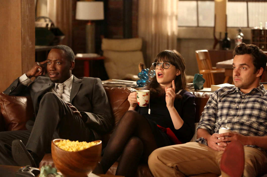 NEW GIRL: L-R: Winston (Lamorne Morris), Jess (Zooey Deschanel) and Nick (Jake Johnson) listen as Schmidt tells them of his plans for their big party celebrating Nick and Schmidt's tenth anniversary of living together in the "TinFinit" episode of NEW GIRL airing Tuesday, Feb. 26 (9:00-9:30 PM ET/PT)