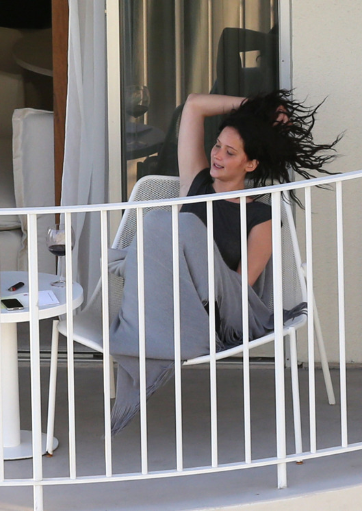 51025629 Oscar winner Jennifer Lawrence is seen relaxing with a bottle of wine and a friend while on vacation in Hawaii on February 27, 2013. FameFlynet, Inc - Beverly Hills, CA, USA - +1 (818) 307-4813
