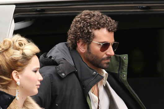 Exclusive... 51055571 "Silver Linings Playbook" costars Jennifer Lawrence and Bradley Cooper are back together again on the set of the new untitled David O. Russell film on April 2, 2013 in Boston, Massachusetts. The pair arrived on set together in full 70's wardrobe. Bradley "Sexiest Man Alive" Cooper is looking to one-up Christain Bale's movie comb-over with a nice head of short Jheri curls for his role in this film!