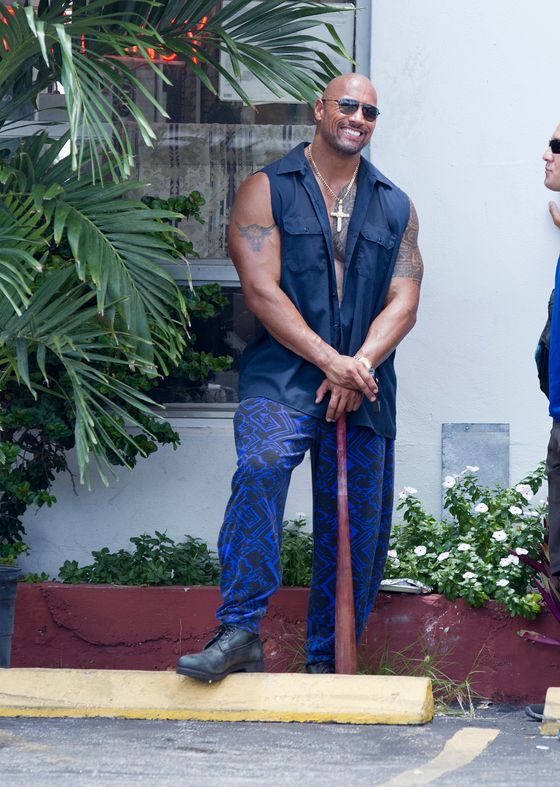The Rock, Dwayne Johnson, shows off his baseball swing filming scenes for the movie "Pain and Gain" with Mark Wahlberg in Miami.