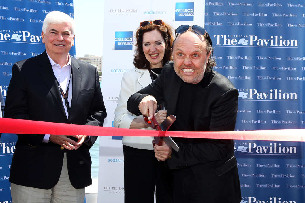 Lars Ulrich of Metallica cuts the ribbon to open the American Pavilion during the 66th Annual Cannes Film Festival at the American Pavilion on May 17, 2013 in Cannes, France.