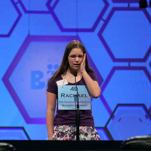 NATIONAL HARBOR, MD - MAY 30: Rachael Cundey reacts to spelling a word corectly during the third round of the 2012 Scripps National Spelling Bee competition May 30, 2012 in National Harbor, Maryland. 278 spellers are competing in the 85th annual competition. (Photo by Mark Wilson/Getty Images)
