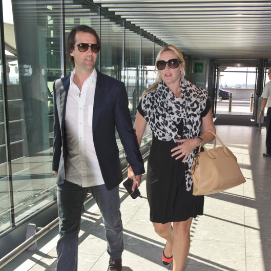 A pregnant Kate Winslet and husband Ned RockNRoll depart Heathrow Airport for Toronto.
<P>
Pictured: Ned Rocknroll and Kate Winslet
<P><B>Ref: SPL605917 050913 </B><BR/>
Picture by: Splash News<BR/>
</P><P>
<B>Splash News and Pictures</B><BR/>
Los Angeles: 310-821-2666<BR/>
New York: 212-619-2666<BR/>
London: 870-934-2666<BR/>
photodesk@splashnews.com<BR/>
</P>
