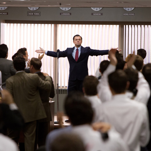 Leonardo DiCaprio (center, standing) plays Jordan Belfort in THE WOLF OF WALL STREET, from Paramount Pictures and Red Granite Pictures.