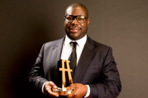 Director Steve McQueen poses with the Hollywood Breakout Director Award for '12 Years a Slave' in the portrait studio during the 17th annual Hollywood Film Awards at The Beverly Hilton Hotel on October 21, 2013 in Beverly Hills, California.