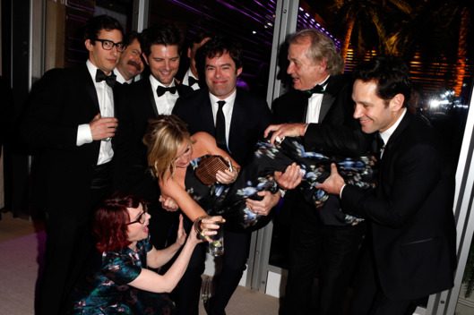 WEST HOLLYWOOD, CA - MARCH 02: (EXCLUSIVE ACCESS, SPECIAL RATES APPLY) (L-R) Actors Andy Samberg, Nick Offerman, Megan Mullally (in front, crouching), Adam Scott, Amy Poehler (being held), Bill Hader, Bill Murray, and Paul Rudd attend the 2014 Vanity Fair Oscar Party Hosted By Graydon Carter on March 2, 2014 in West Hollywood, California. (Photo by Jeff Vespa/VF14/WireImage)