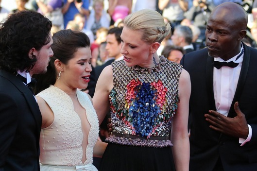 US actress America Ferrera (2ndL) reacts, surrounded by British actor Kit Harington (L), Australian actress Cate Blanchett (2ndR) and Benin's actor Djimon Hounsou, after an unidentified man tried to slip under her dress as she was arriving for the screening of the animated film "How to train your Dragon 2" at the 67th edition of the Cannes Film Festival in Cannes, southern France, on May 16, 2014.