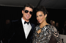 Recording artist Robin Thicke (L) and actress Paula Patton attend the 56th GRAMMY Awards at Staples Center on January 26, 2014 in Los Angeles, California.