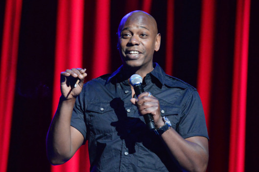NEW YORK, NY - JUNE 18: Dave Chappelle performs onstage at Radio City Music Hall on June 18, 2014 in New York City. (Photo by Kevin Mazur/WireImage)