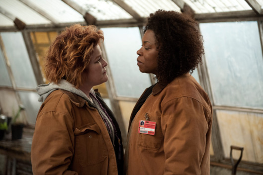Kate Mulgrew (L) and Lorraine Toussaint (R) in a scene from Netflix’s “Orange is the New Black” Season 2. Photo credit: JoJo Whilden for Netflix.