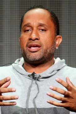 Executive producer Larry Wilmore and Creator/executive producer Kenya Barris speak onstage at the 'Black-ish'' panel during the Disney/ABC Television Group portion of the 2014 Summer Television Critics Association at The Beverly Hilton Hotel on July 15, 2014 in Beverly Hills, California.