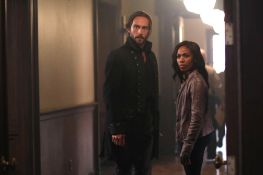 SLEEPY HOLLOW: Ichabod (Tom Mison, L) and Abbie (Nicole Beharie, R) see an unexpected person in the "Root of All Evil" episode of SLEEPY HOLLOW airing Monday, Oct. 6 (9:00-10:00 PM ET/PT) on FOX. ?2014 Fox Broadcasting Co. CR: Fred Norris/FOX