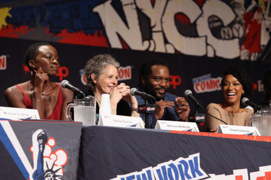 NEW YORK, NY - OCTOBER 11: Danai Gurira, Melissa McBride, Chad L. Coleman and Sonequa Martin-Green speak at "The Walking Dead" NY Comic Con Panel on October 11, 2014 in New York City. (Photo by Robin Marchant/Getty Images for AMC)
