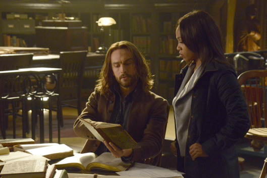 SLEEPY HOLLOW: Ichabod (Tom Mison, L) and Abbie (Nicole Beharie, R) look for a dangerous book of spells in the "Spellcaster" episode of SLEEPY HOLLOW aiirng Monday, Feb. 2 (9:00-10:00 PM ET/PT) on FOX. ?2014 Fox Broadcasting Co. CR: Brownie Harris/FOX