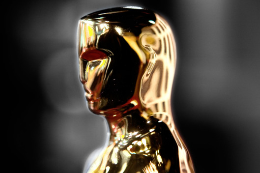 12 Feb 2007, New York City, New York State, USA --- A golden Oscar? statuette stands on display in New York City, as part of the "Meet the Oscars?, New York" exhibition of statuettes from the Academy of Motion Picture Arts and Sciences. The 79th Academy Awards? ceremony will be held in Los Angeles on February 25, 2007. Oscar? statuette: ?A.M.P.A.S.? --- Image by ? David Brabyn/Corbis