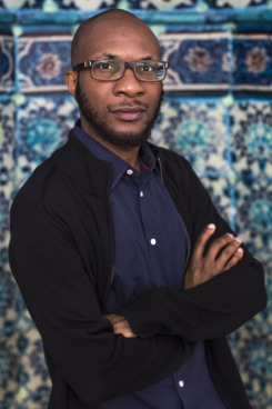 HEBRON - WEST BANK - JUNE 3: Nigerian-American writer Teju Cole poses for a portrait inside the Ibrahimi mosque or Tomb of the Patriarchs during a 2014 Palestine Festival of Literature tour on June 3, 2014 in Hebron, West Bank. The festival is an annual event that aims to bring a cultural festival of international standard to audiences in Palestine to assert "the power of culture over the culture of power." (Photo by Rob Stothard/Getty Images)