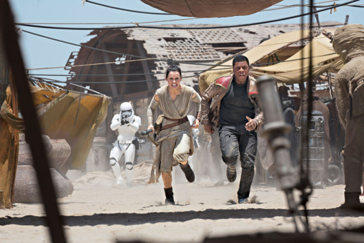 Star Wars: The Force Awakens. L to R: Rey (Daisy Ridley) and Finn (John Boyega).