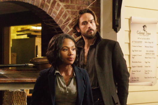 SLEEPY HOLLOW: Ichabod Crane (Tom Mison, L) and Abbie (Nicole Beharie, R) try to come up with a plan in the "I, Witness" season two premiere episode of SLEEPY HOLLOW airing Monday, Oct. 1 (9:00-10:00 PM ET/PT) on FOX. ©2014 Fox Broadcasting Co. CR: Tina Rowden/FOX