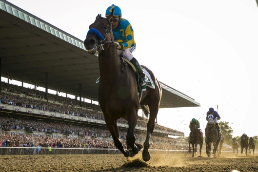 Espinoza, aboard American Pharoah, rides after winning the 147th running of the Belmont Stakes as well as the Triple Crown, in Elmont, New York