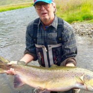Eric Clapton Just Caught a Record-Setting Salmon in Iceland, and For One Moment, Everything Is Okay in the World