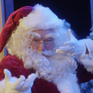 Bryan Cranston Stars as Kris Kringle and Evil Goth Kris Kringle in Colbert’s Kid-Made Santa Fight