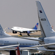 epa03387784 (FILE) A file photo dated 18 November 2008 shows an airplane of Egypt's state-owned carrier, EgyptAir, landing next to exhibited aircrafts at Middle East Business Aviation (MEBA) Exhibition at the airport of Dubai, United Arab Emirates. Media reports state that EgyptAir was forced to cancel all of its international flights on 07 September 2012 due to a strike by air steward crews. The cancellations follow the collapse of negotiations between the company and stewards demanding better working conditions and higher wages. Unions have vowed not to end their strike until all their demands are met. EPA/ALI HAIDER