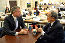 New York City Mayor Michael Bloomberg meets with Mayor-Elect Bill de Blasio on November 6, 2013 at City Hall, the morning after De Blasio was elected New York Citys first Democratic mayor in two decades. De Blasio won a stunning landslide victory of 73.3 percent of votes cast compared to 24.3 percent for his Republican rival Joe Lhota, according to results from 99 percent of polling stations. But of the 4.6 million registered voters in New York only 1.02 million actually cast their vote, based on those results. AFP PHOTO / TIMOTHY CLARY (Photo credit should read TIMOTHY CLARY/AFP/Getty Images)