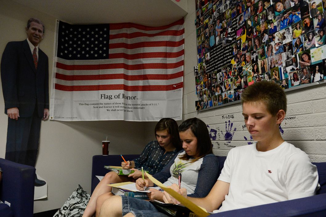 WHEAT RIDGE, CO. - SEPTEMBER 25: Wheat Ridge High School students from left to right, Jana McVey, 15, Michaela Zavala, 14, and Chay Martin, 15, work on classwork in Stephanie Rossi's sophomore AP U.S. History class Thursday afternoon, September 25, 2014. Their teacher, Stephanie Rossi, is against the Jefferson County School board member's proposal to change the AP U.S. History curriculum which includes promoting patriotic material, respect for authority and the free-market system and avoiding material about civil disorder, social stripe and disregard for the law. (Photo By Andy Cross / The Denver Post)