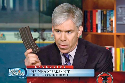 This video frame grab image provided by"Meet the Press" shows host David Gregory holding what he described as a high-capacity ammunition magazine during a recent Sunday's program.  Gregory won't face charges for displaying what he said was a high-capacity ammunition magazine on his "Meet the Press" show. D.C. prosecutors announced the decision Friday, saying criminal charges wouldn't serve the public's best interests.  (AP Photo/Meet the Press)