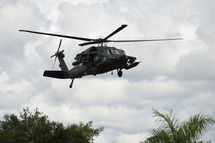 An artillery helicopter type Black Hawk AH-60L "Arpia" of the Colombian Air Force flies over in Quibdo, Department of Choco, Colombia, on November 21, 2014. The government of Juan Manuel Santos expects the speedy release of Brigadier General Ruben Alzate, Cabo Jorge Rodriguez and lawyer Gloria Urrego captured Sunday in Choco (west), and soldiers Cesar Rivera and Jhonatan Diaz held prisoners since November 9 after fighting in the department of Arauca (eastern, border with Venezuela). AFP PHOTO/LUIS ROBAYO (Photo credit should read LUIS ROBAYO/AFP/Getty Images)