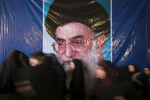 Iranian veiled women walk past a portrait of Iran's supreme Leader Ayatollah ALI KHAMENEI at the tomb of Iran's late leader Ayatollah RUHOLLAH KHOMEINI during a ceremony marking the anniversary of the Islamic Revolution in southern Tehran. Morteza Nikoubazl/ZUMAPRESS (Credit Image: ? Morteza Nikoubazl/ZUMA Wire)