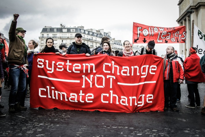 Thousands of people on a march for global climate justice in Paris