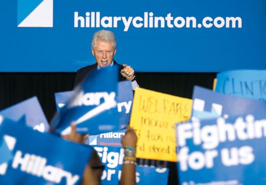 Former President Bill Clinton has a heated exchange with a protester during a rally for Democratic presidential candidate Hillary Clinton, Thursday April 7, 2016, in Philadelphia. Bill Clinton was interrupted by people in the crowd holding signs reading "Clinton crime bill destroyed our communities" and "Welfare reform increased poverty." (Ed Hille/The Philadelphia Inquirer via AP)  PHIX OUT; TV OUT; MAGS OUT; NEWARK OUT; MANDATORY CREDIT