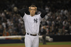 NEW YORK, NY - OCTOBER 06: Mark Teixeira #25 of the New York Yankees reacts after he was stranded on first base when Nick Swisher #33 struck out with the bases loaded to end the bottom of the seventh inning during Game Five of the American League Championship Series at Yankee Stadium on October 6, 2011 in the Bronx borough of New York City. (Photo by Nick Laham/Getty Images)