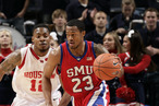 Paul McCoy #23 of the SMU Mustangs brings the ball upcourt past Aubrey Coleman #12 of the Houston Cougars during Round One of the Conference USA Basketball Tournament at FedExForum on March 11, 2009 in Memphis, Tennessee.