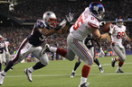 Jake Ballard #85 of the New York Giants scores against the defense of Tracy White #58 of the New England Patriots in the second half on November 6, 2011 in Foxboro, Massachusetts.