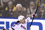 New York Rangers' Ryan Callahan (24) celebrates his game-winning goal on Buffalo Sabres goalie Ryan Miller during a shootout of an NHL hockey game in Buffalo, N.Y., Wednesday, Feb. 1, 2012.
