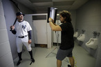 New York Yankees' Alex Rodriguez, left, poses for photographer Nick Laham on photo day