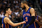 Jeremy Lin #17 of the New York Knicks talks with Tyson Chandler #6 during play against the Dallas Mavericks at American Airlines Center