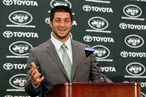 Quarterback Tim Tebow addresses the media as he is introduced as a New York Jet at the Atlantic Health Jets Training Center on March 26, 2012 in Florham Park, New Jersey.