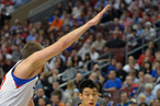 Jeremy Lin #17 of the New York Knicks drives around Spencer Hawes #00 of the Philadelphia 76ers