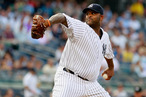 CC Sabathia #52 of the New York Yankees pitches in the first-inning against the Toronto Blue Jays at Yankee Stadium on July 17, 2012