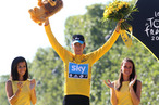Bradley Wiggins of Great Britain and Sky Procycling receives the last yellow jersey during the trophy ceremony, after the twentieth and final stage of the 2012 Tour de France, from Rambouillet to the Champs-Elysees on July 22, 2012 in Paris, France