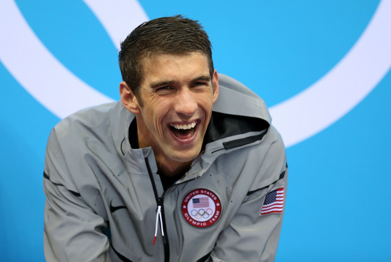 Gold Medallist Michaell Phelps of the United States smiles prior to receiving his medal on the podium during the medal ceremony for the Men's 4 x 200m Freestyle Relay final on Day 4 of the London 2012 Olympic Games at the Aquatics Centre on July 31, 2012 in London, England.