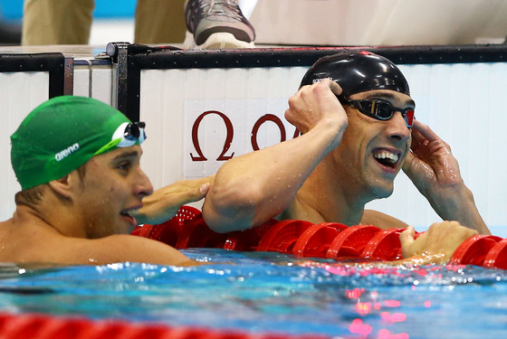 Michael Phelps of the United States celebrates winning the Mens 100m Butterfly Final on Day 7 of the London 2012 Olympic Games at the Aquatics Centre on August 3, 2012 in London, England.
