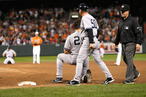 BALTIMORE, MD - SEPTEMBER 08: First base umpire Jerry Meals walks away after calling Mark Teixeira #25 of the New York Yankees out for the last out of the game during the Yankees 5-4 loss to the Baltimore Orioles at Oriole Park at Camden Yards on September 8, 2012 in Baltimore, Maryland. At right is first base coach Mick Kelleher. (Photo by Rob Carr/Getty Images)