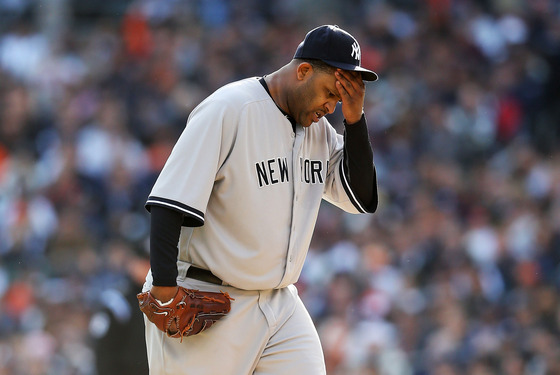 DETROIT, MI - OCTOBER 18: CC Sabathia #52 of the New York Yankees wipes his forehead with his hand against the Detroit Tigers during game four of the American League Championship Series at Comerica Park on October 18, 2012 in Detroit, Michigan. (Photo by Leon Halip/Getty Images)