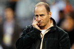 DETROIT, MI - OCTOBER 17: New York Yankees general manager Brian Cashman talks on the phone on the field during batting practice against the Detroit Tigers during game four of the American League Championship Series at Comerica Park on October 17, 2012 in Detroit, Michigan. (Photo by Gregory Shamus/Getty Images)