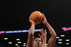 Joe Johnson #7 of the Brooklyn Nets gets the shot off over Paul Pierce #34 of the Boston Celtics at the Barclays Center on November 15, 2012 in the Brooklyn borough of New York City.
